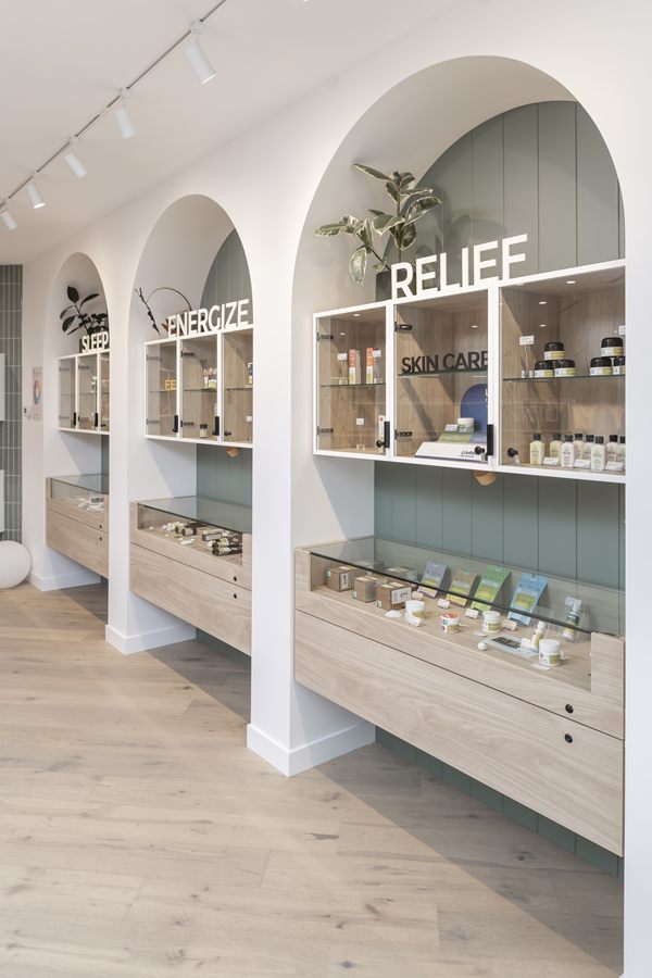 Arched display bays with oak shelving