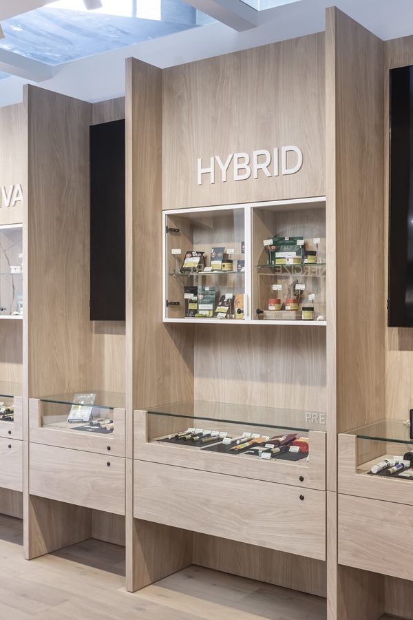 Oak display tower with backlit shelves