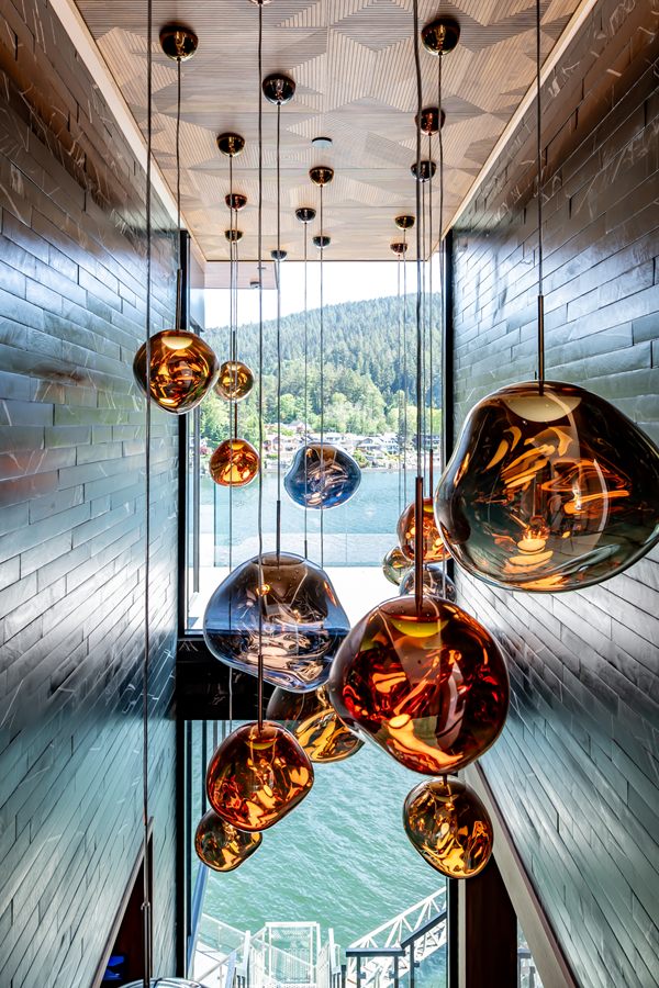 Glass pendants hanging through a double-height stairwell