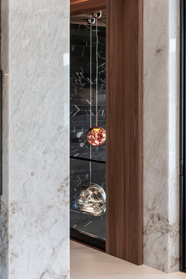 Marble column and walnut display cabinet