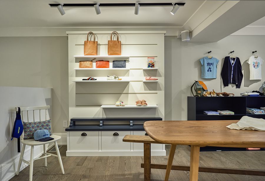 Painted wall unit with open shelves and drawers