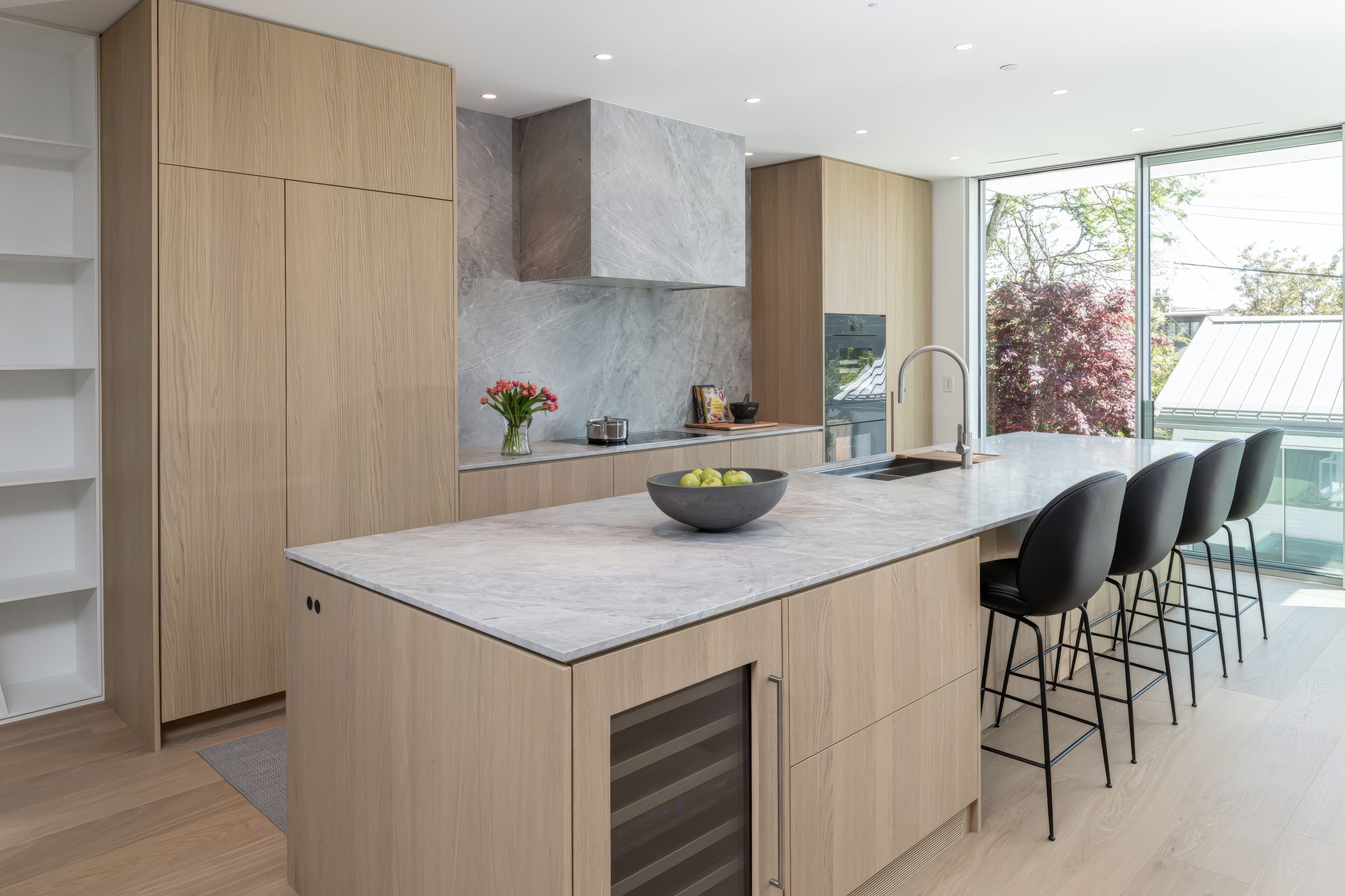 Dunbar House kitchen with white oak cabinetry and a marble island
