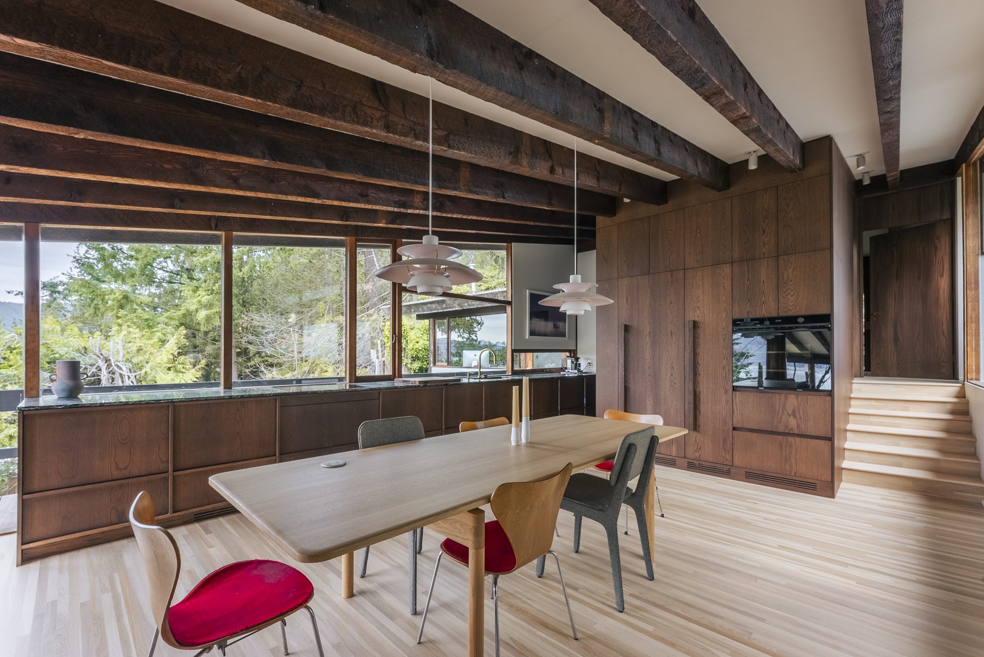 Keith Residence dining room and wood kitchen under exposed timber beams