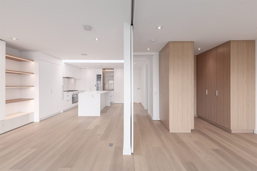 Open-plan floor with white oak tall cabinets