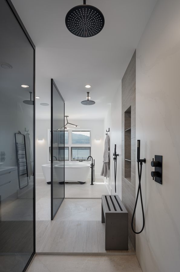 Primary ensuite with black-framed glass shower