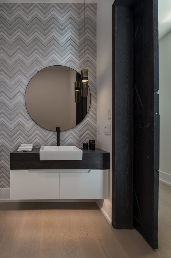 Powder room with a black floating vanity