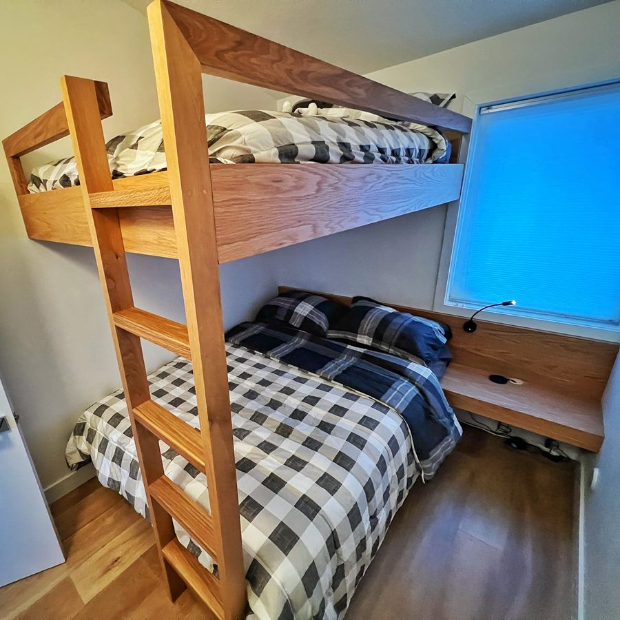 Custom wood bunk bed with built-in ladder