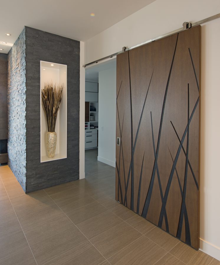 Walnut sliding door with inlaid metal detail